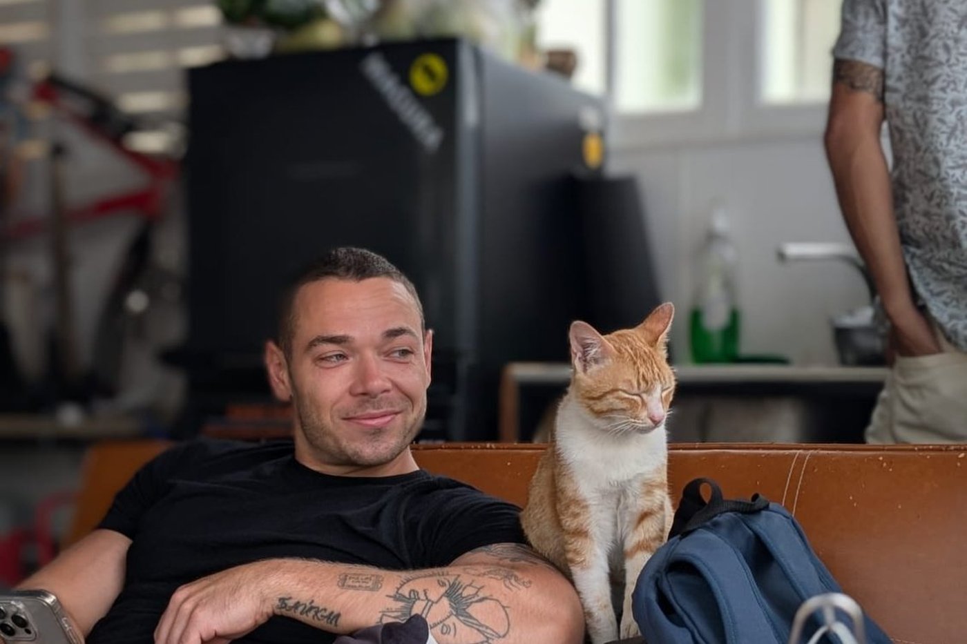 Relaxing at the Bike Hub with the orange cat